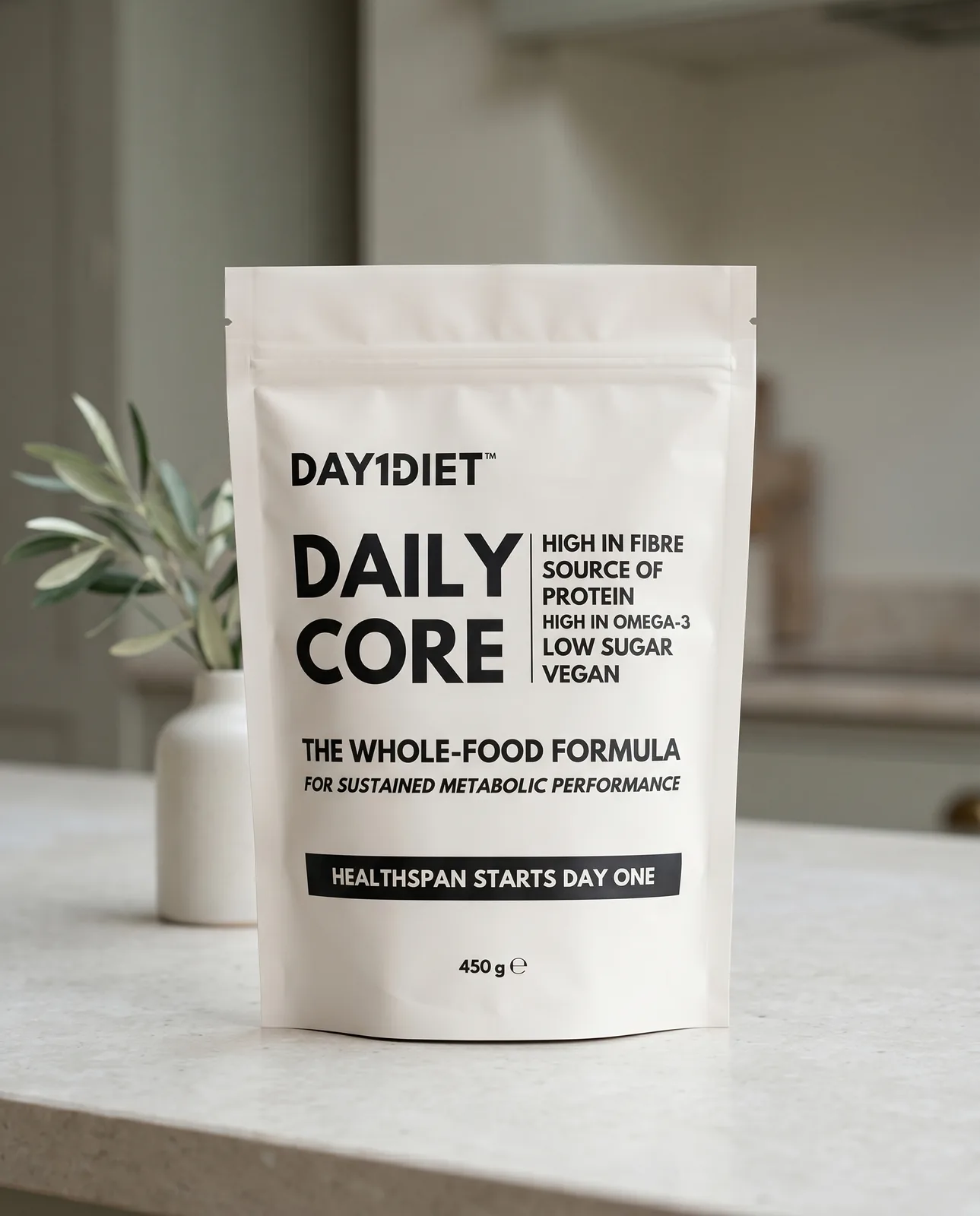 Day1Diet Daily Core pouch standing on a kitchen counter, packshot lighting true to the pack