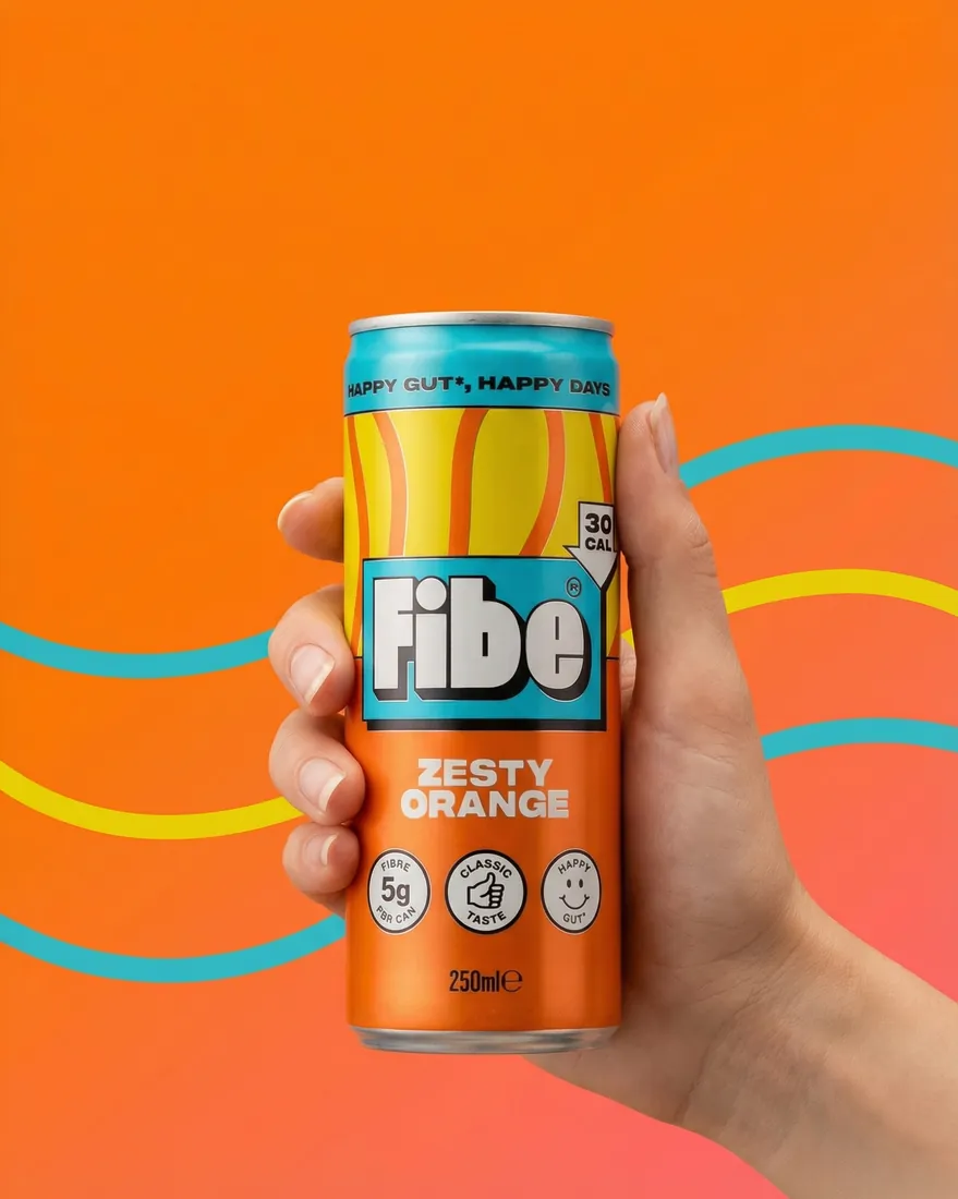 Editorial image of a hand holding a fibre drink can against a stylised graphic orange backdrop