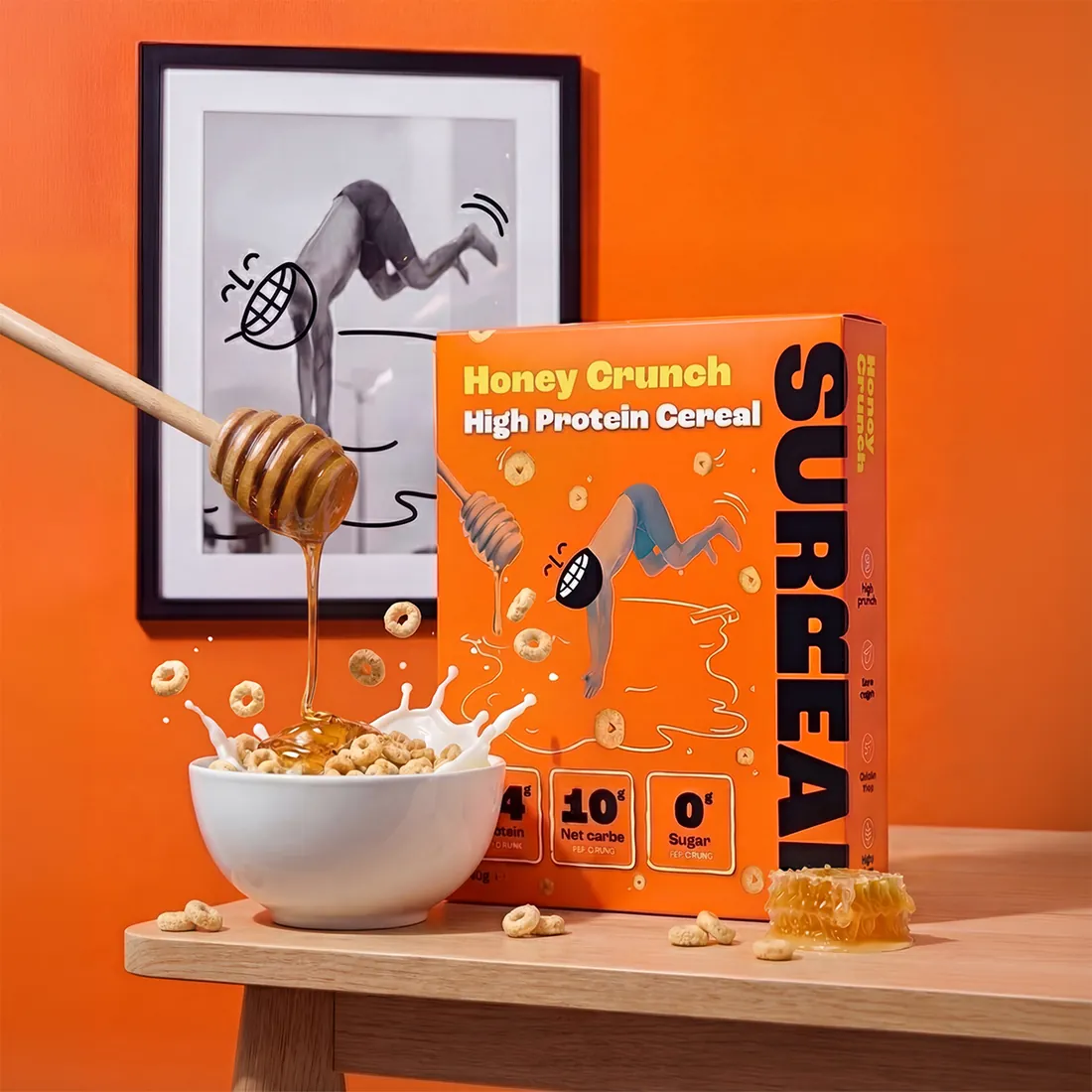 Hero image of a cereal carton with honey drizzle and milk splash against a framed art backdrop